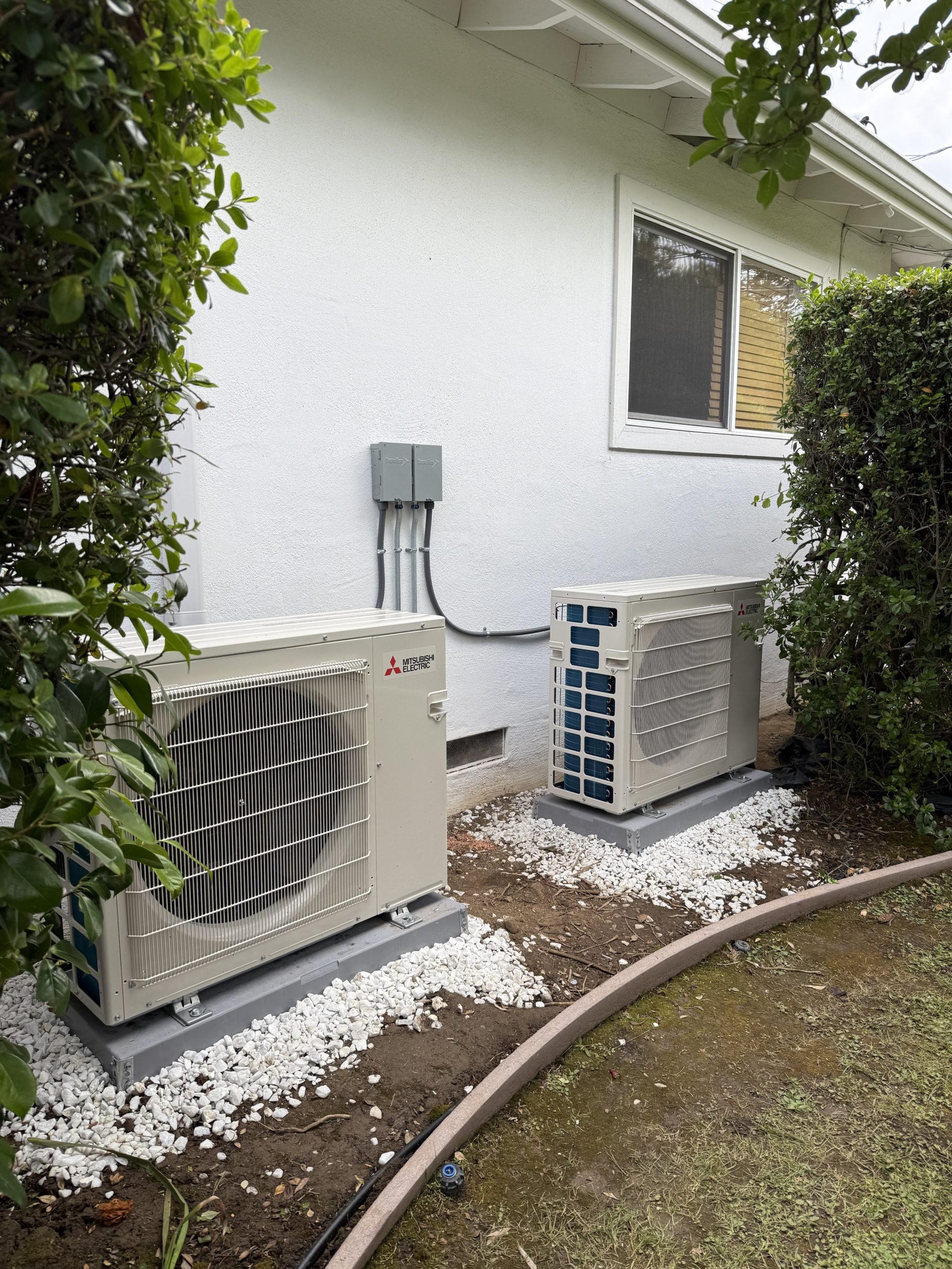 Heat pump equipment beside a residential property