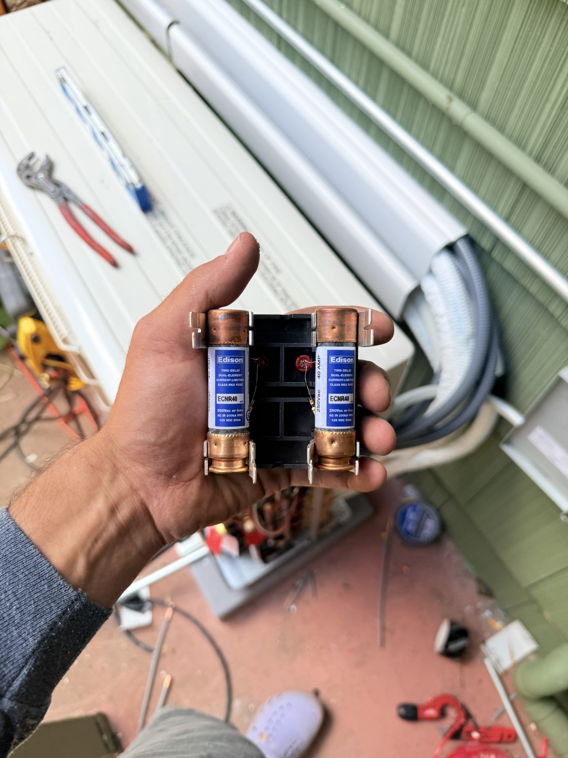 HVAC electrical component held during service