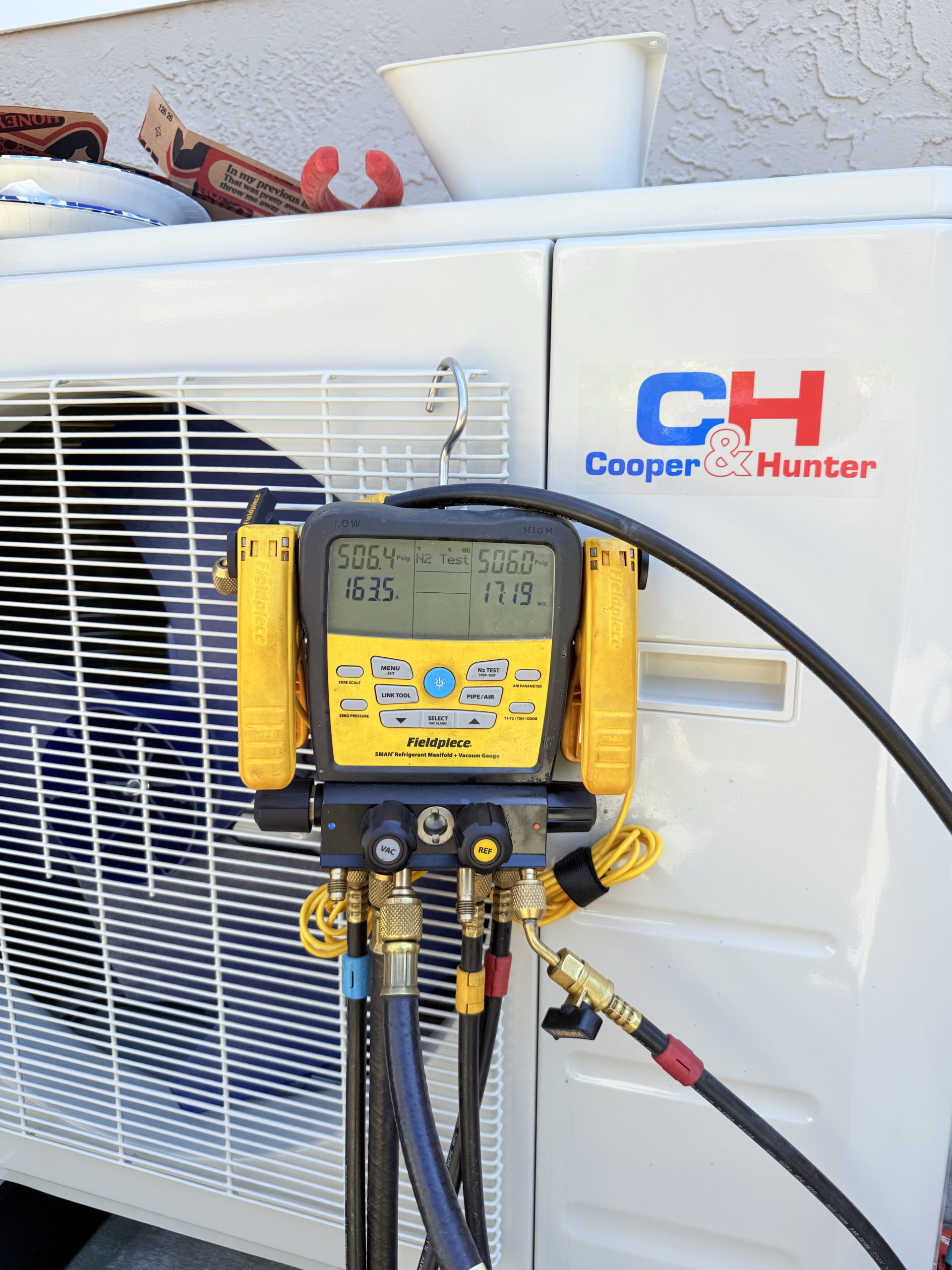 HVAC testing equipment connected to an outdoor unit