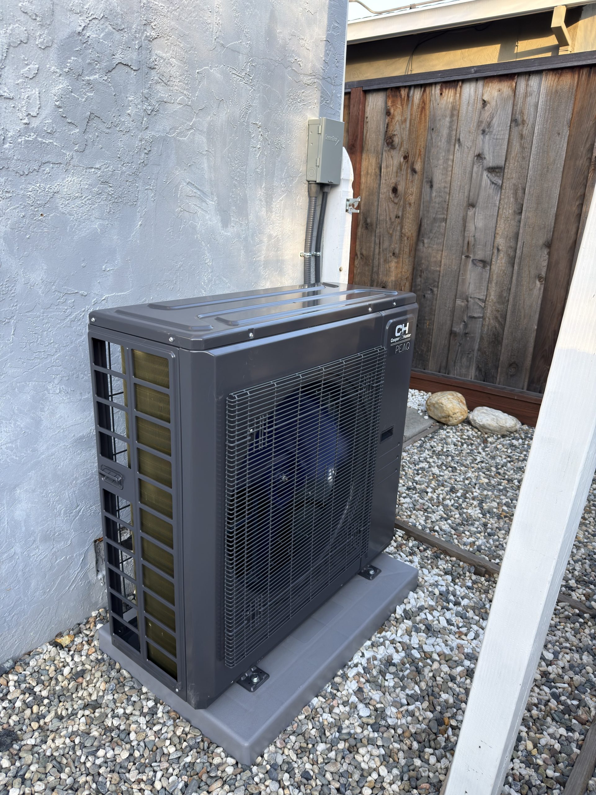 Outdoor HVAC equipment beside a home
